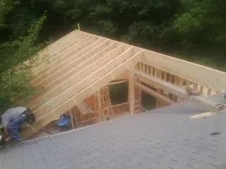 Framing a new roof addition that ties into an existing shingle roof in Pompton Lakes